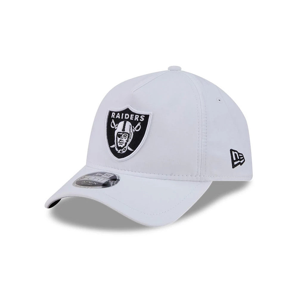 Las Vegas Raiders NFL Quickstrike White New Era 9FORTY Apex Adjustable Cap, three-quarter view showing the raised black and white Raiders logo in embroidered detail on the front panel, with a curved visor and the New Era flag logo on the left side.