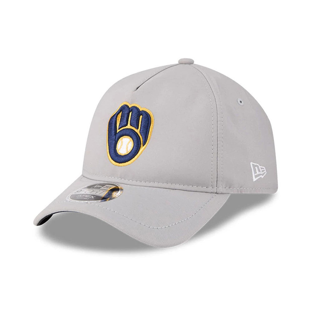 Milwaukee Brewers MLB Quickstrike Grey New Era 9FORTY Apex Adjustable Cap, three-quarter view showing the navy and gold Brewers logo with a raised embroidery on the front panel, curved grey visor, and white New Era flag logo on the left side.