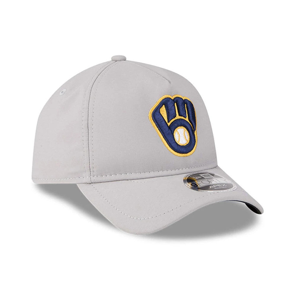 Milwaukee Brewers MLB Quickstrike Grey New Era 9FORTY Apex Adjustable Cap, three-quarter view showing the raised embroidered blue and yellow logo on the front panel, with a curved grey visor and a 9FORTY size sticker on the visor.