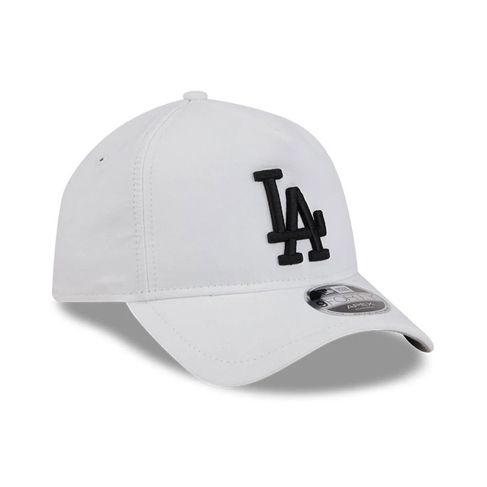 LA Dodgers MLB Quickstrike White New Era 9FORTY Apex Adjustable Cap, three-quarter view showing the black LA logo in raised embroidery on the front panel, a curved white visor with a 9FORTY size sticker, and a white top button.