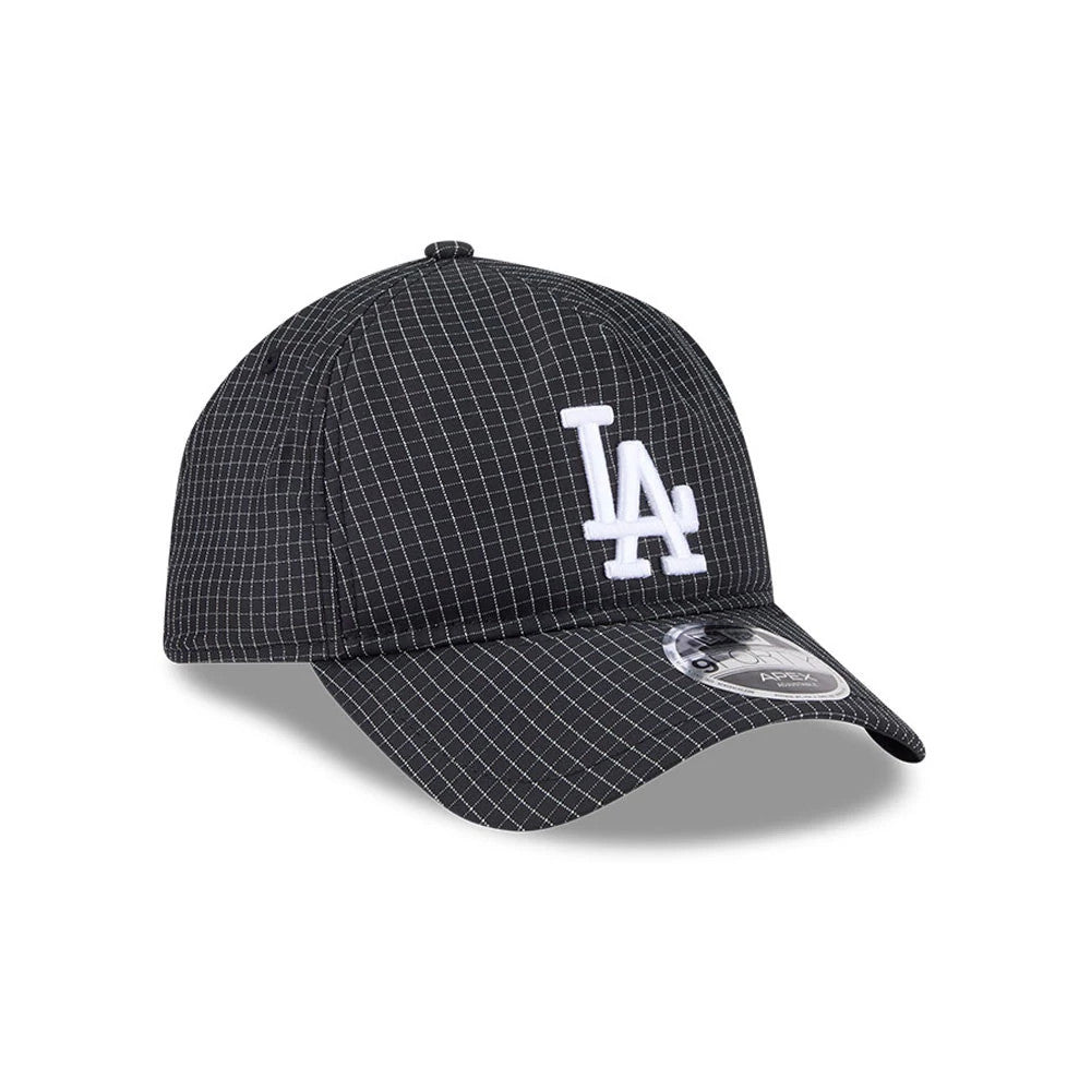 LA Dodgers MLB Quickstrike Black New Era 9FORTY Apex Adjustable Cap, three-quarter view showing the white embroidered LA logo on the structured black crown with grid lines, curved black visor, and 9FORTY size sticker on the right side of the visor.