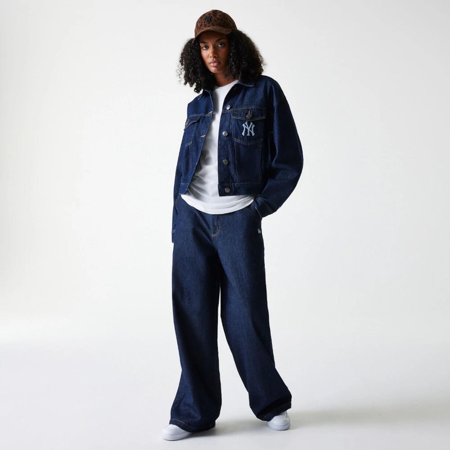 The model is wearing this Womens MLB Denim New York Yankees Jacket in dark blue. 7