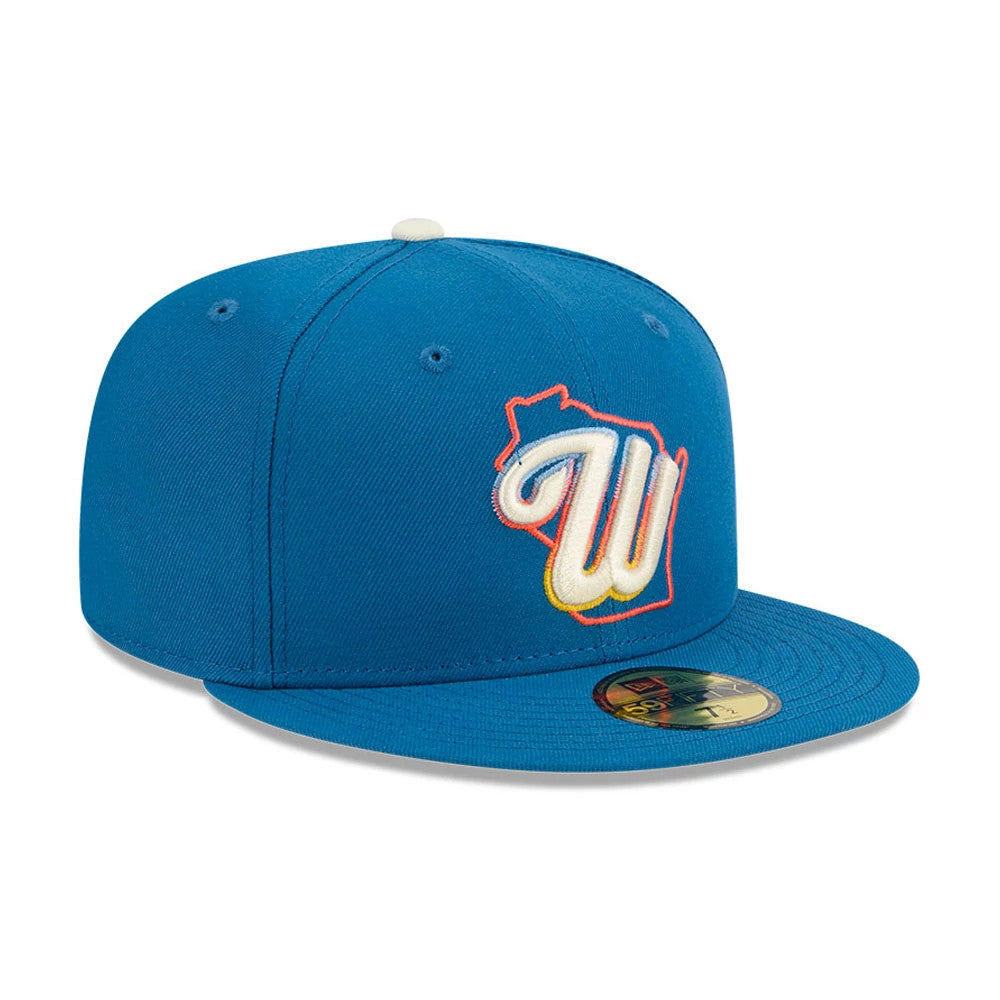 Milwaukee Brewers MLB City Connect Blue New Era 59FIFTY Fitted Cap, front view showing the raised white W logo with orange outline on the front panel, complementing the flat blue visor with a gold 59FIFTY size sticker.