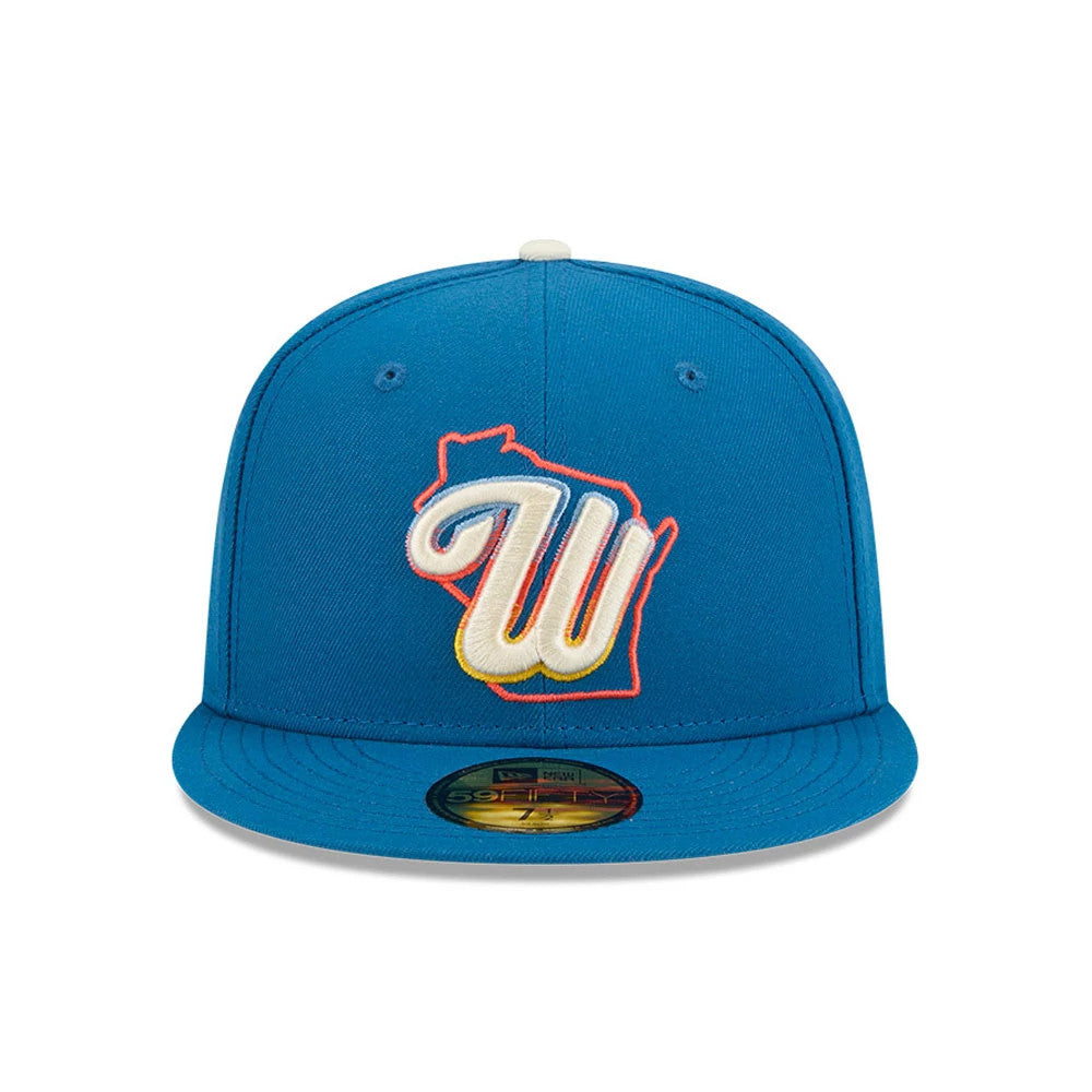 Milwaukee Brewers MLB City Connect Blue New Era 59FIFTY Fitted Cap, front view showing a raised W embroidered in cream with an orange outline on the structured blue front panel, and featuring a gold 59FIFTY size sticker on the flat blue visor.