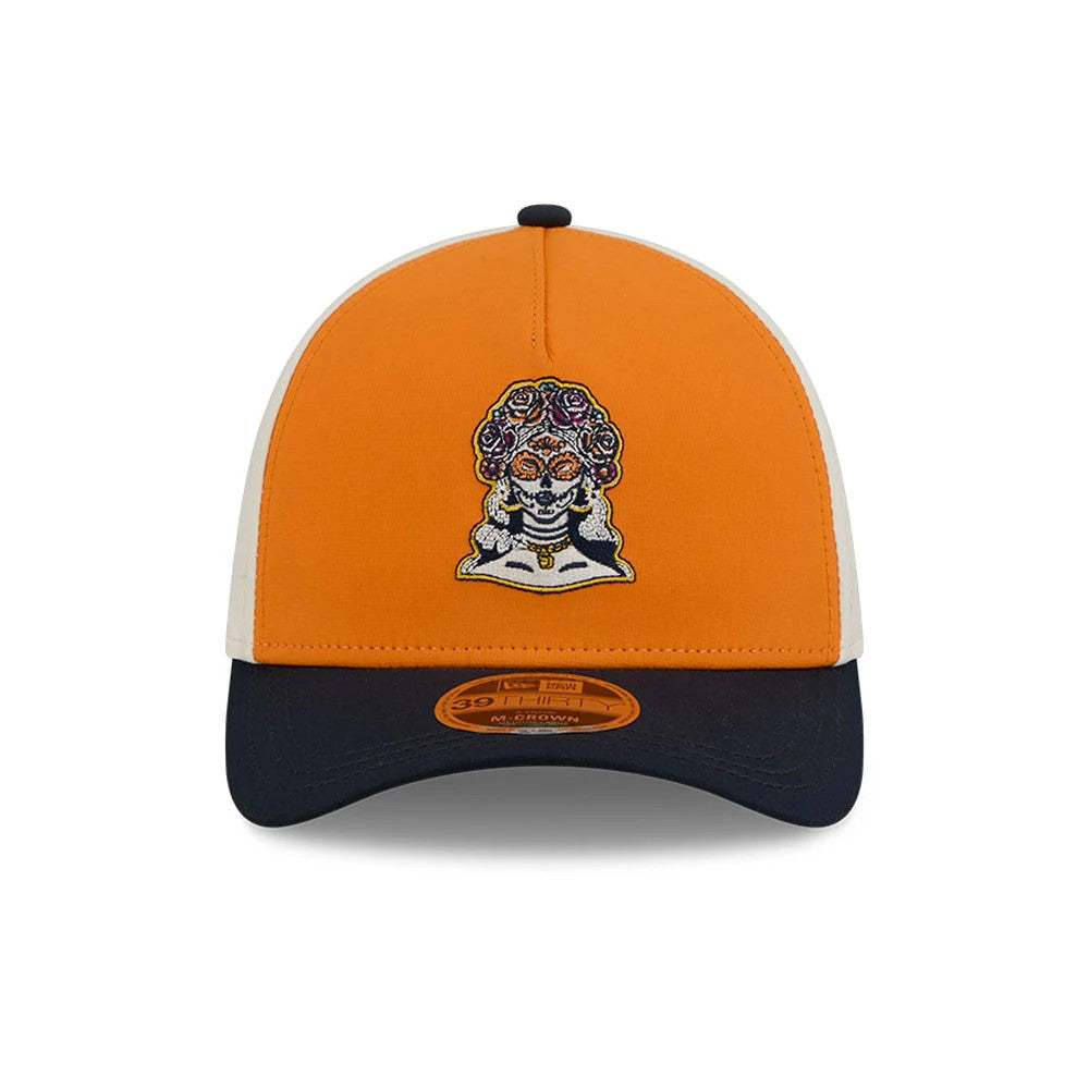 Padres MLB City Connect Orange New Era 39THIRTY M-Crown A-Frame Stretch Fit Cap, front view showing a detailed sugar skull embroidered on the orange front panel, navy visor with an orange 39THIRTY size sticker, and contrasting white side panels.