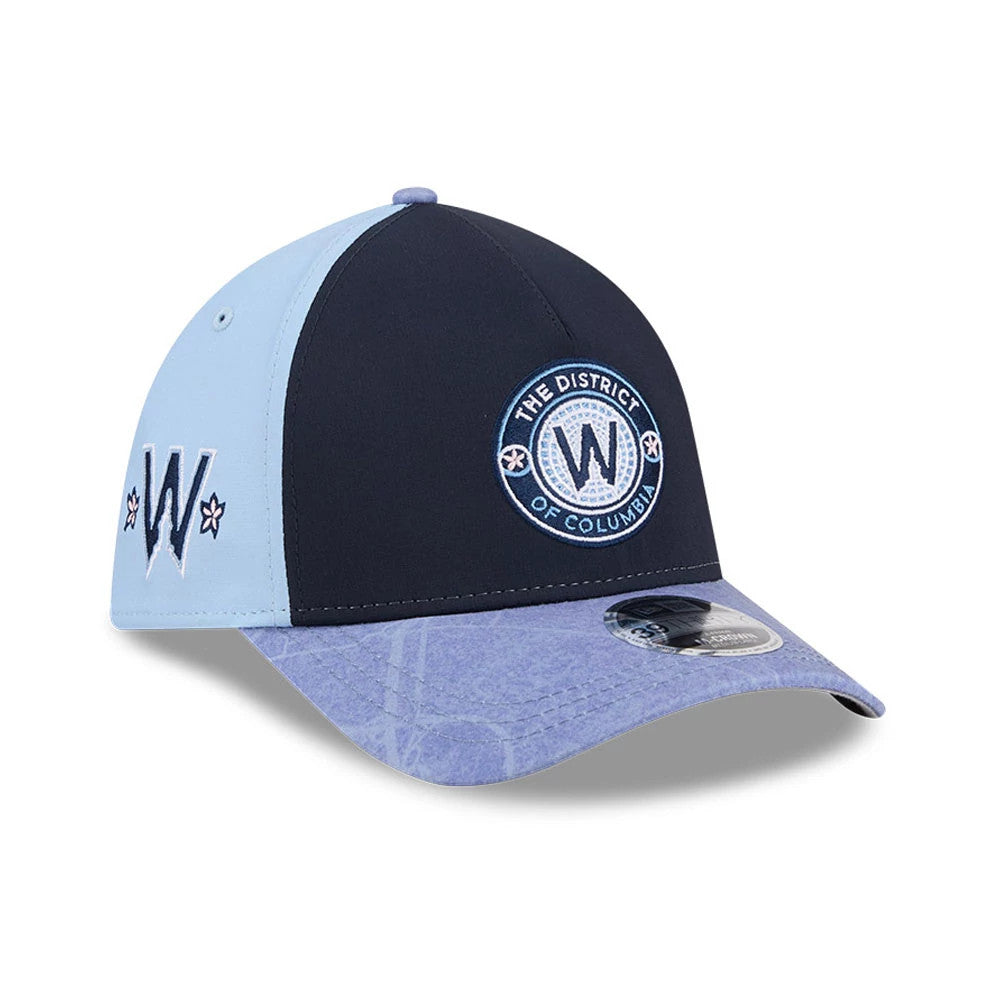 Nationals MLB City Connect Navy New Era 39THIRTY M-Crown A-Frame Stretch Fit Cap, three-quarter view showing the navy front panel with white embroidered The District of Columbia circular logo and light blue visor with a 39THIRTY size sticker.