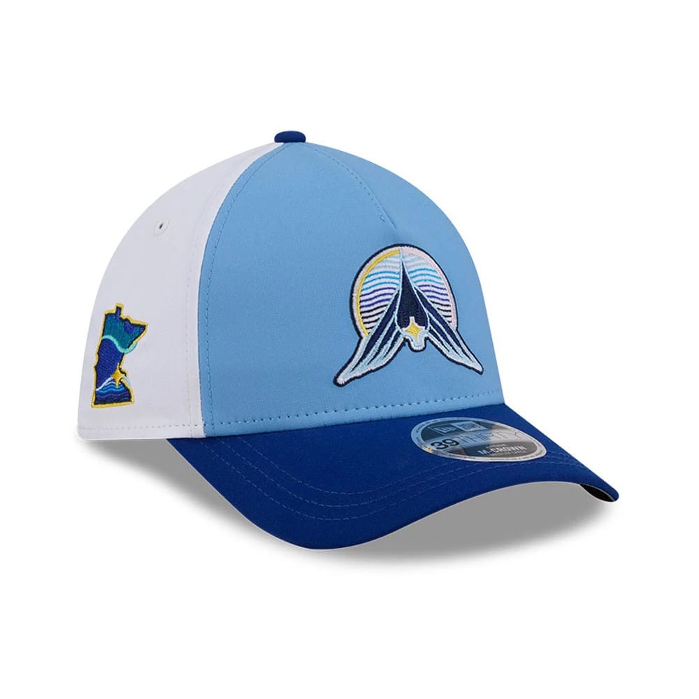 Twins MLB City Connect Blue New Era 39THIRTY M-Crown A-Frame Stretch Fit Cap, three-quarter view showing a multicoloured front panel logo with a star and lines, contrasting blue curved visor with 39THIRTY size sticker.