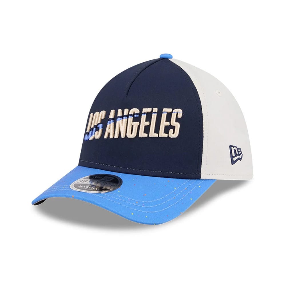 Dodgers MLB City Connect Navy New Era 39THIRTY M-Crown A-Frame Stretch Fit Cap, three-quarter view showing cream Los Angeles lettering on the navy front, white side panels with blue New Era flag logo, and a speckled light blue curved visor.