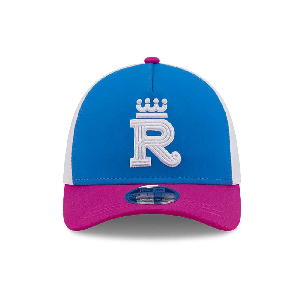 Royals MLB City Connect Blue New Era 39THIRTY M-Crown A-Frame Stretch Fit Cap, front view showing a white embroidered crowned R logo on a blue structured crown, with a magenta curved visor and a 39THIRTY size sticker.