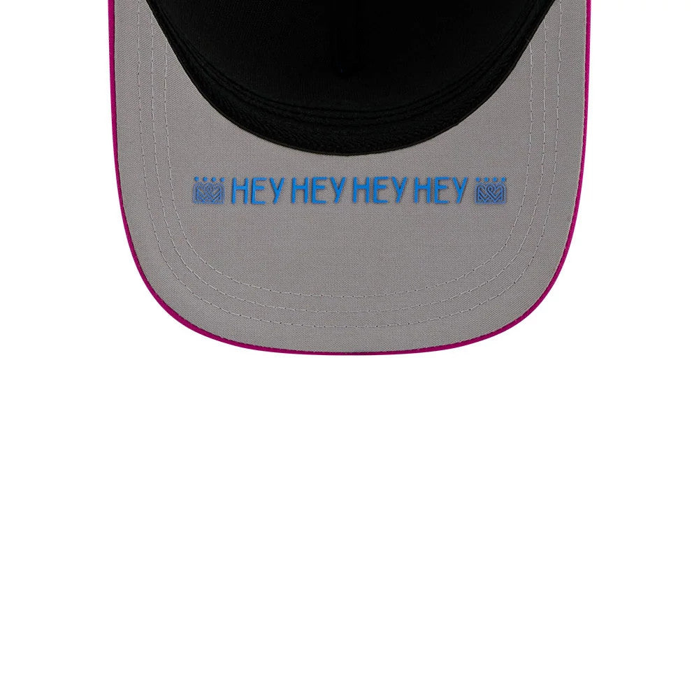 Royals MLB City Connect Blue New Era 39THIRTY M-Crown A-Frame Stretch Fit Cap, inside view showing blue HEY HEY HEY HEY embroidery on the grey undervisor, with contrasting pink visor edging and detailed stitching.