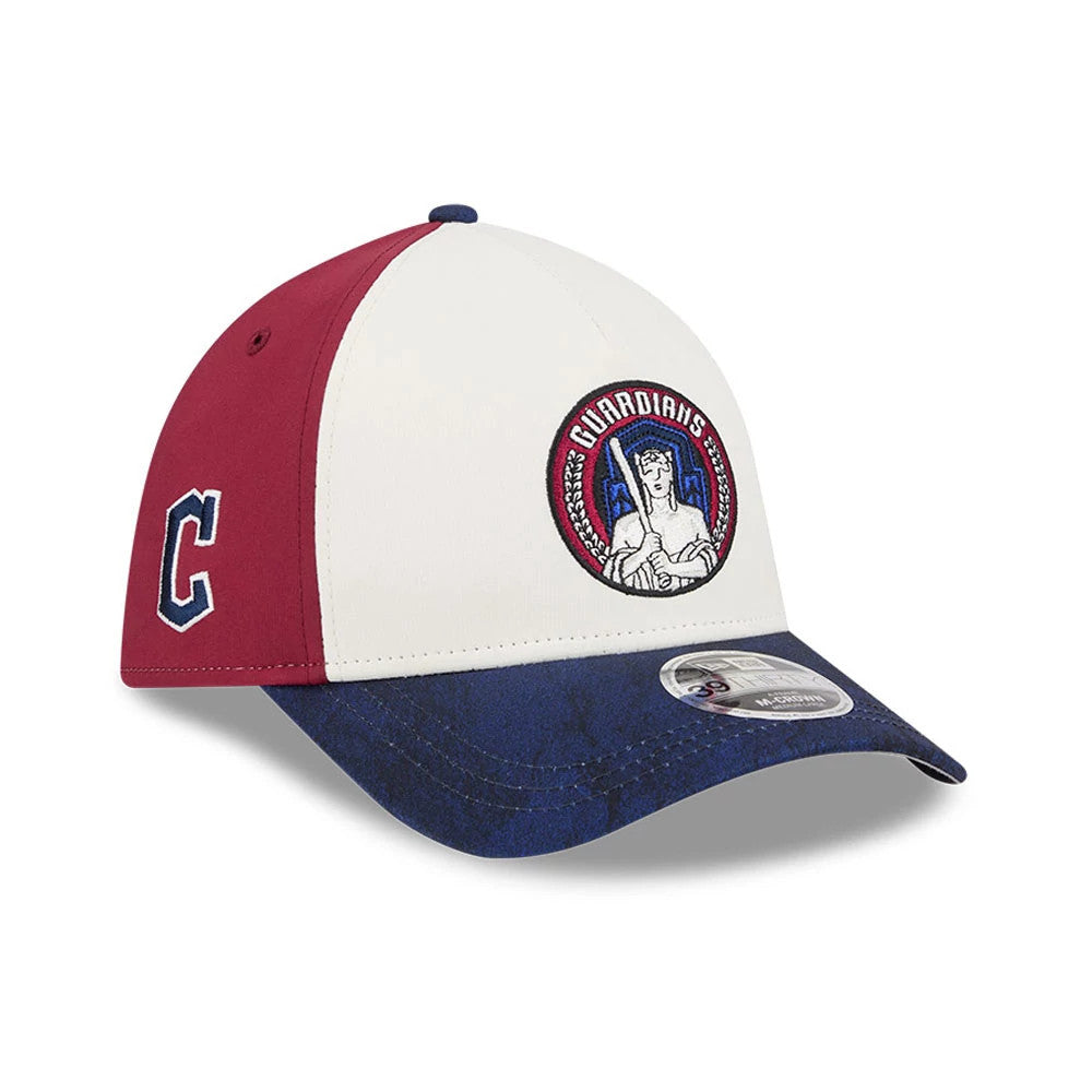 Guardians MLB City Connect White New Era 39THIRTY M-Crown A-Frame Stretch Fit Cap, front view showing a red embroidered Guardians logo on the white front panel, dark blue visor with a 39THIRTY size sticker, and a red side panel with a C logo.