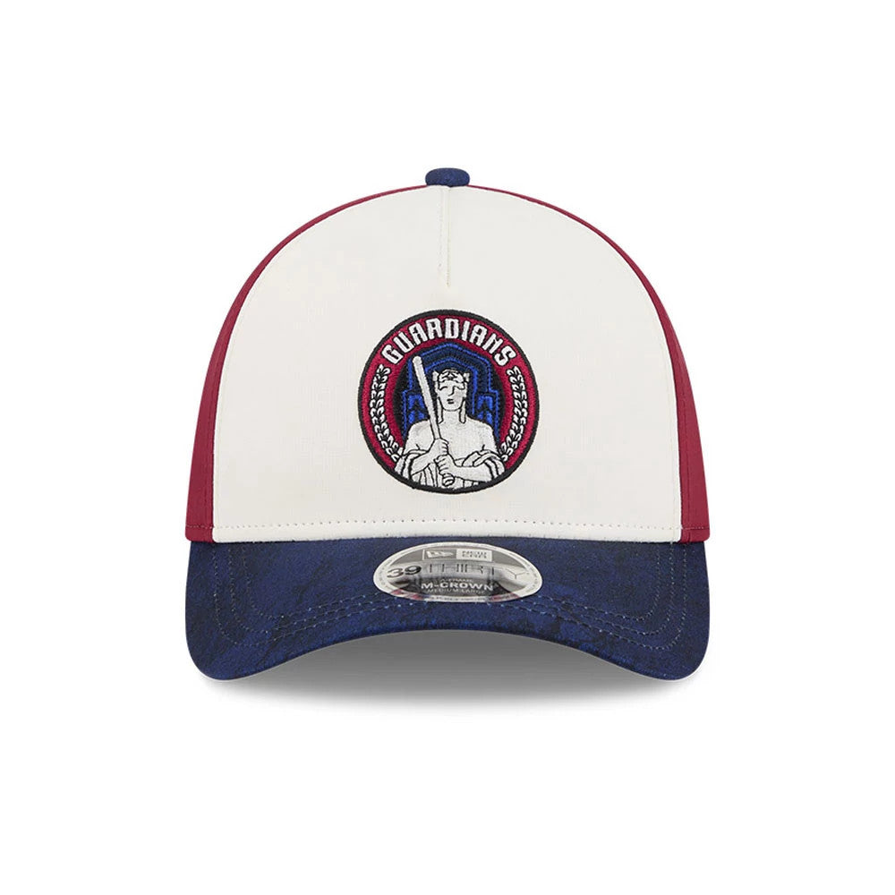 Guardians MLB City Connect White New Era 39THIRTY M-Crown A-Frame Stretch Fit Cap, front view showing the Guardians logo embroidered in blue and red on the white front panel, with a dark blue visor and a 39THIRTY size sticker.