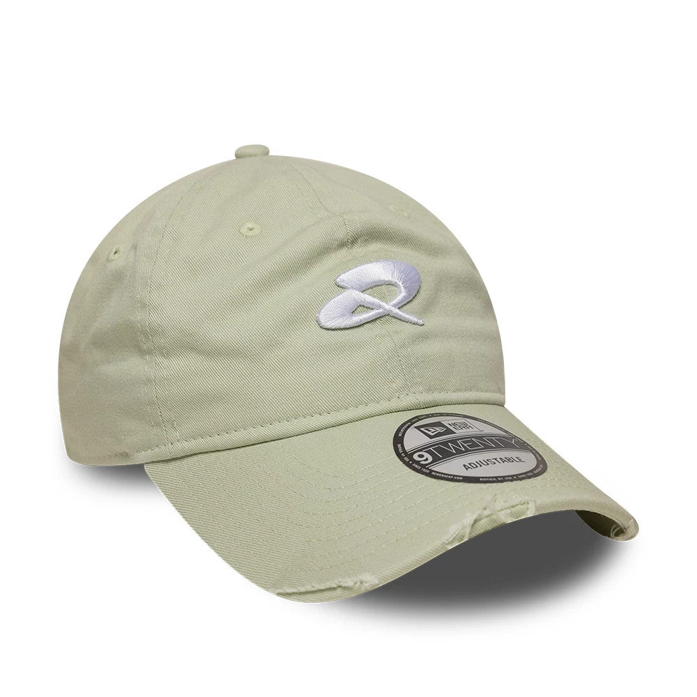 Quadrant X New Era Distressed Pastel Green 9TWENTY Cap, three-quarter view showing a white and grey embroidered Quadrant X logo on the front panel, with a matching curved visor and a 9TWENTY size sticker on the visor.
