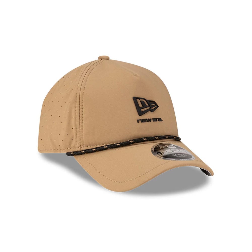 New Era Beige 9FORTY Apex Cap, three-quarter view showing a black embroidered New Era flag logo on the front panel, a curved beige visor with a 9FORTY size sticker, and a decorative rope detail above the visor.