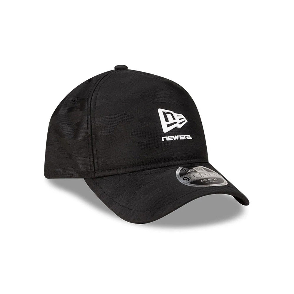 New Era Black 9FORTY Apex Cap, three-quarter view showing a white New Era flag logo with newera text on the front panel, a curved visor with a 9FORTY size sticker, and camo pattern on the structured black crown.