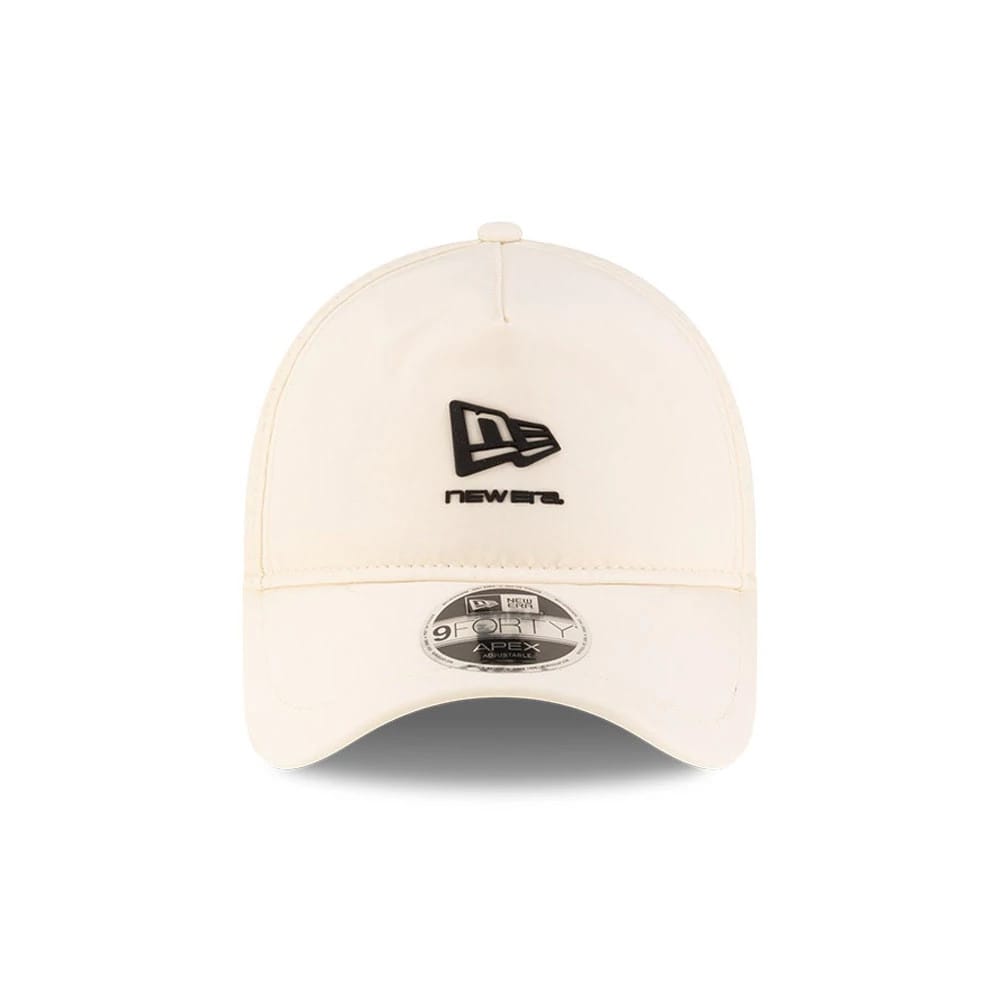 New Era Light Beige 9FORTY Apex Cap, front view showing the black raised embroidered New Era flag logo and text on the central panel, with a curved visor featuring a 9FORTY size sticker.