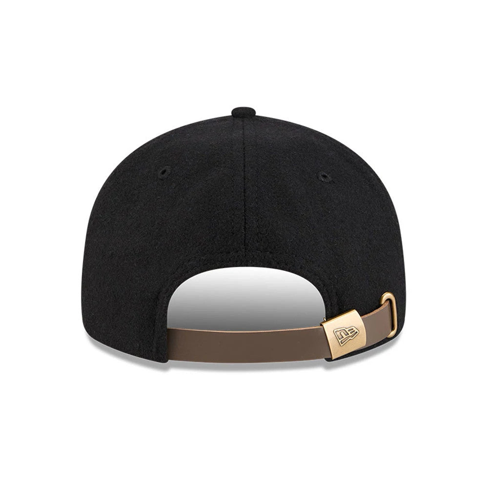 Chicago Bulls NBA Chenille Woven Black Retro Crown New Era 9FIFTY Adjustable Cap, rear view showing a brown adjustable strap with a gold buckle on the black crown, featuring the New Era flag logo embossed on the buckle.