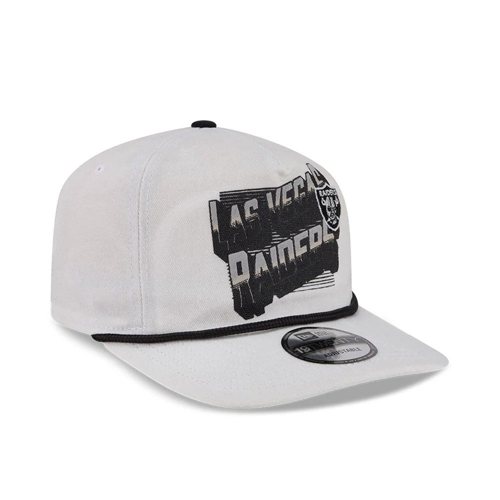 Las Vegas Raiders NFL Duck Cloth White New Era 19TWENTY Adjustable Cap, three-quarter view showing a large black and white Raiders graphic on the front panel, a black piping detail above the visor, and the 19TWENTY size sticker on the curved visor.