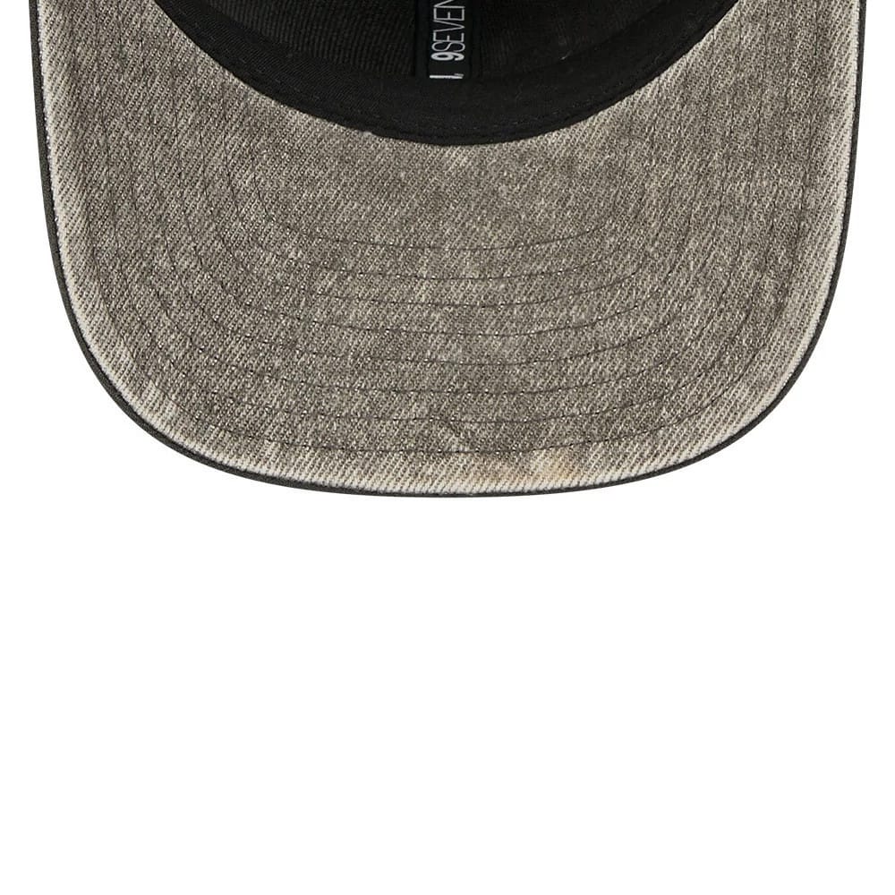 Philadelphia Eagles NFL Washed Denim Dark Grey New Era 9SEVENTY Stretch Snap Cap, inside view showing the dark grey washed denim-effect visor with stitch lines, a black sweatband with 9SEVENTY branding, and a black undervisor.