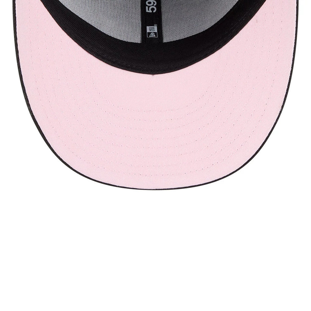 Nickelodeon Fairly Oddparents Black New Era 59FIFTY Fitted Cap, inside view showing a pink undervisor, black sweatband with a 59FIFTY label, and the New Era logo on the taping along the inner seam.