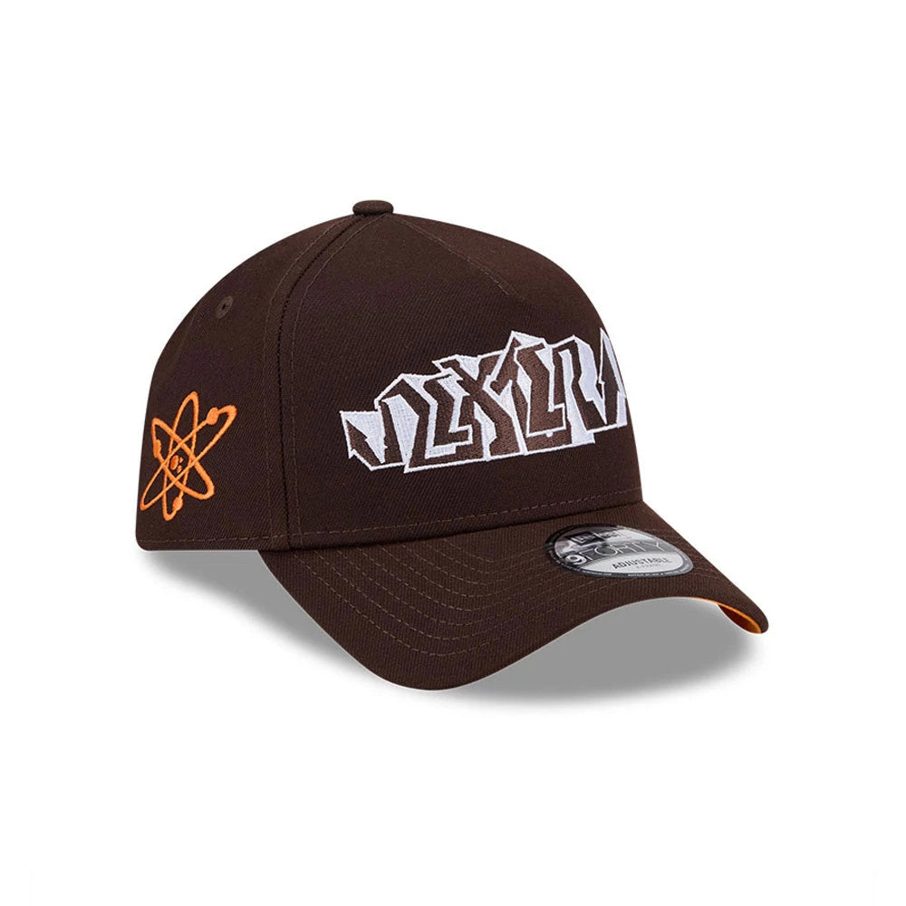 Dexter's Laboratory Dark Brown New Era 9FORTY A-Frame Adjustable Cap, three-quarter view showing the white embroidered Dexter's Laboratory logo on the front panel and an orange atomic symbol logo on the left side, with a curved visor.