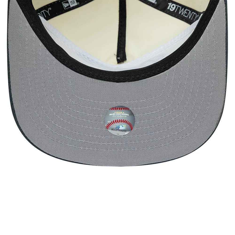 LA Dodgers MLB Metallic Logo Cream New Era 19TWENTY Adjustable Cap, inside view showing the grey undervisor with a Major League Baseball sticker, black internal taping with white branding, and a cream-coloured sweatband lining the inner crown.