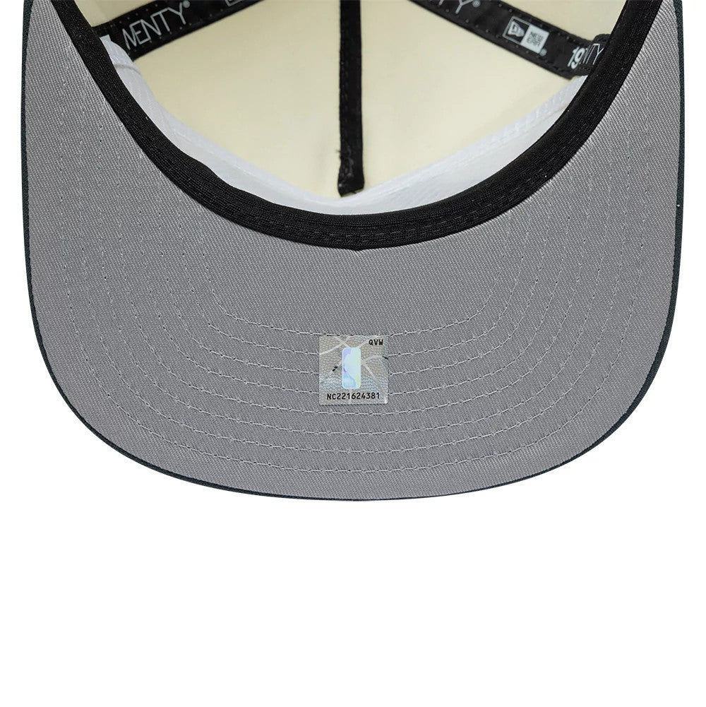LA Lakers NBA Metallic Logo Cream New Era 19TWENTY Adjustable Cap, inside view showing the black sweatband with New Era branding, cream-coloured taping along the seams, and a light grey undervisor with a size sticker at the centre.