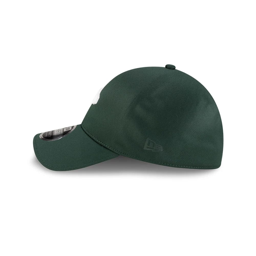 New Era Dark Green 39THIRTY Infinity Stretch Fit Cap, side view showing the dark green New Era flag logo embroidered on the left side of the structured crown, with a curved visor featuring a 39THIRTY size sticker on top.