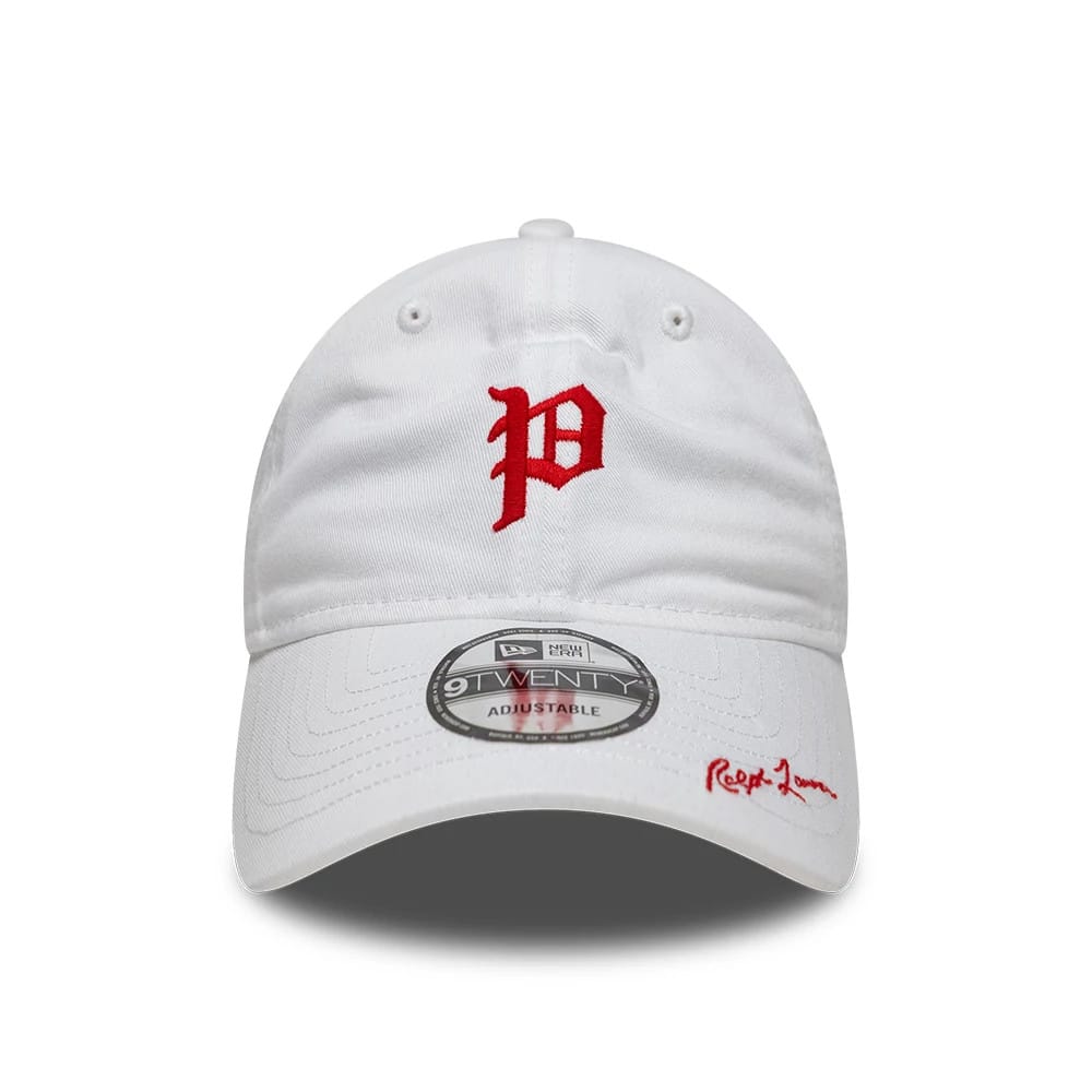 Philadelphia Phillies Ralph Lauren X MLB White New Era 9TWENTY Adjustable Cap, front view showing the red embroidered letter P on the structured white crown, a 9TWENTY size sticker on the white curved visor, and Ralph Lauren signature in red.