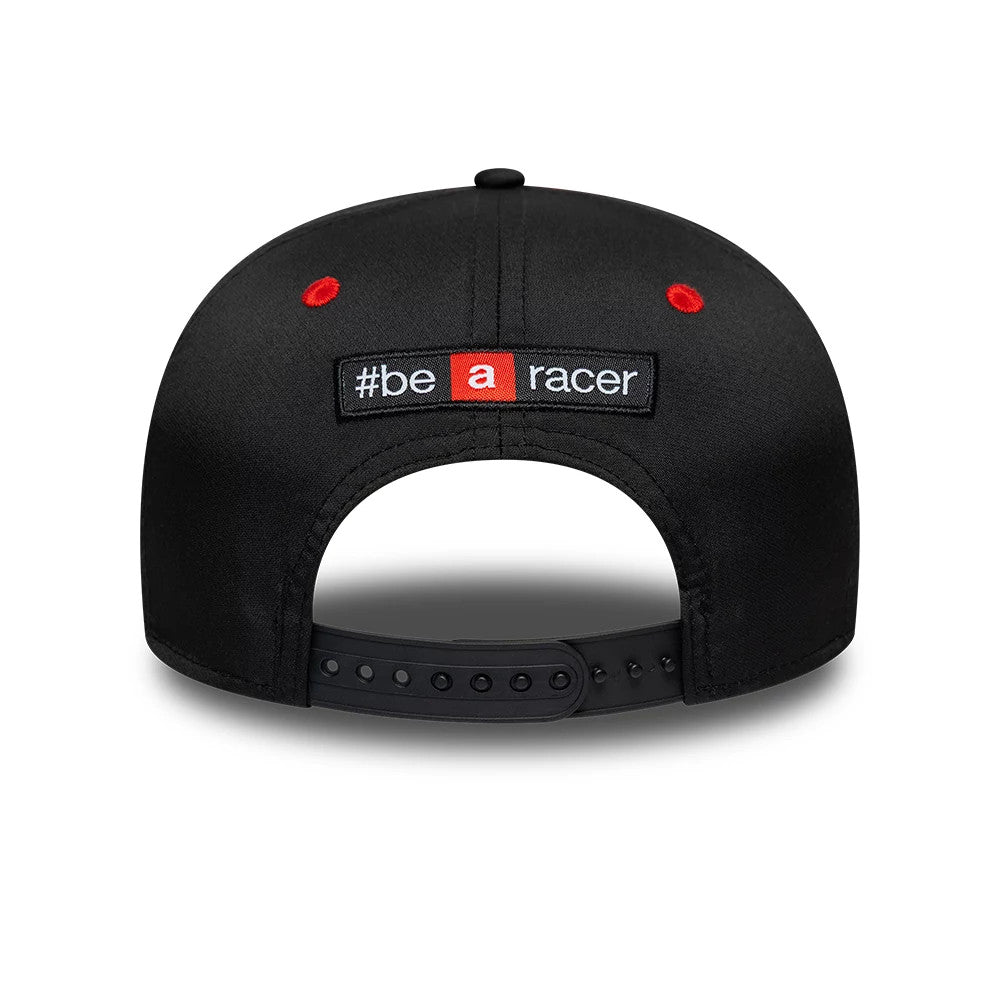 Aprilia Replica Marco Bezzecchi White New Era 9SEVENTY Stretch Snap Adjustable Cap, rear view showing the embroidered #be a racer text in black, white, and red across the adjustable strap, with red eyelets on a black structured crown.