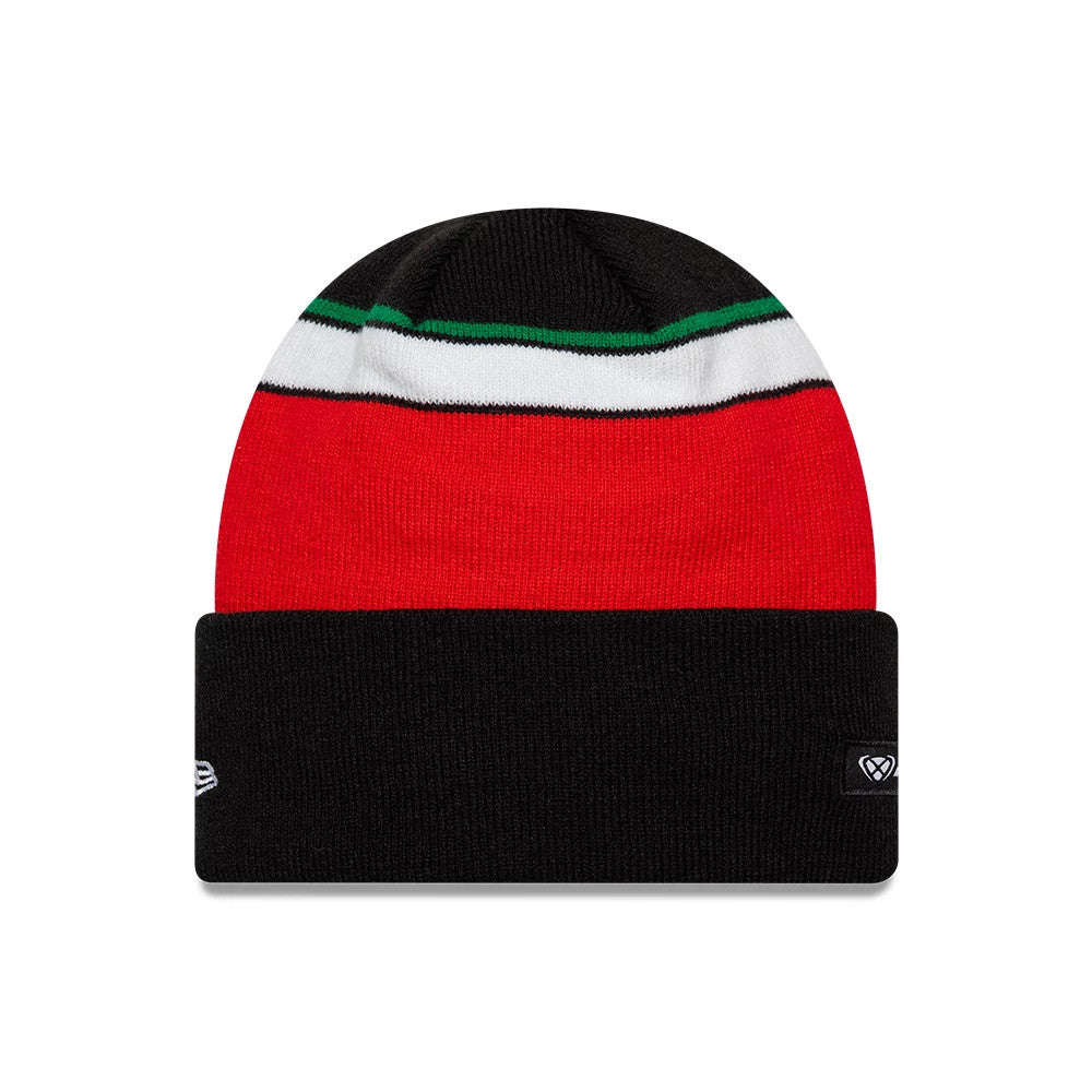 New Era Aprilia Team Black Cuff Knit Beanie Hat, front view showing a black cuff with a red upper section, accented by a white and green stripe across the centre, and featuring two embroidered logos on the cuff's edge.