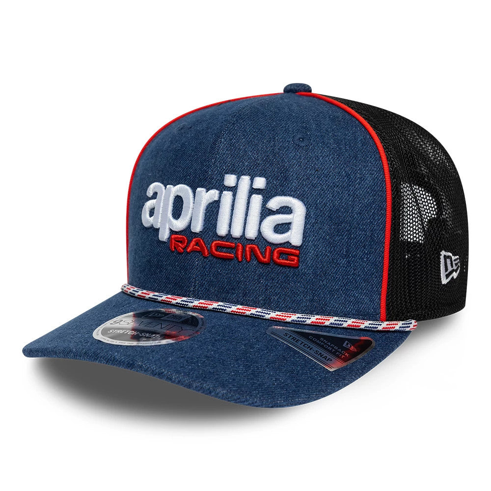 Aprilia Replica Austin Race Special Blue New Era 9SEVENTY Stretch Snap Adjustable Cap, front view showing white raised aprilia lettering and red embroidered RACING text on the blue front panel, with a red-trimmed visor and a navy, red.