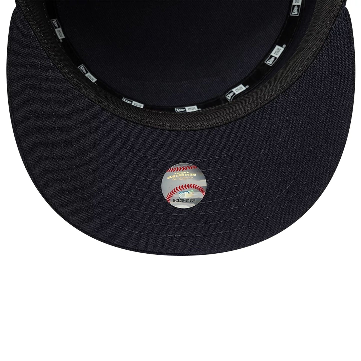 New Era New York Yankees MLB Poly Navy Pillbox Adjustable Cap, inside view showing the dark navy undervisor, a round baseball-themed sticker, and black sweatband with repeating New Era logos, complemented by matching manufacturer taping.