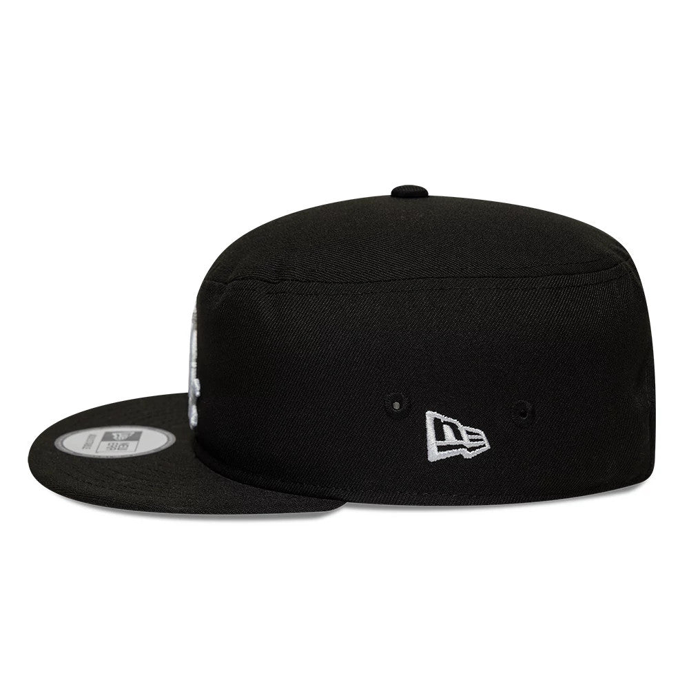 Chicago White Sox MLB Poly Black New Era Pillbox Adjustable Cap, side view showing the New Era flag logo embroidered in white on the left side, with a flat black visor and round black crown featuring eyelets.