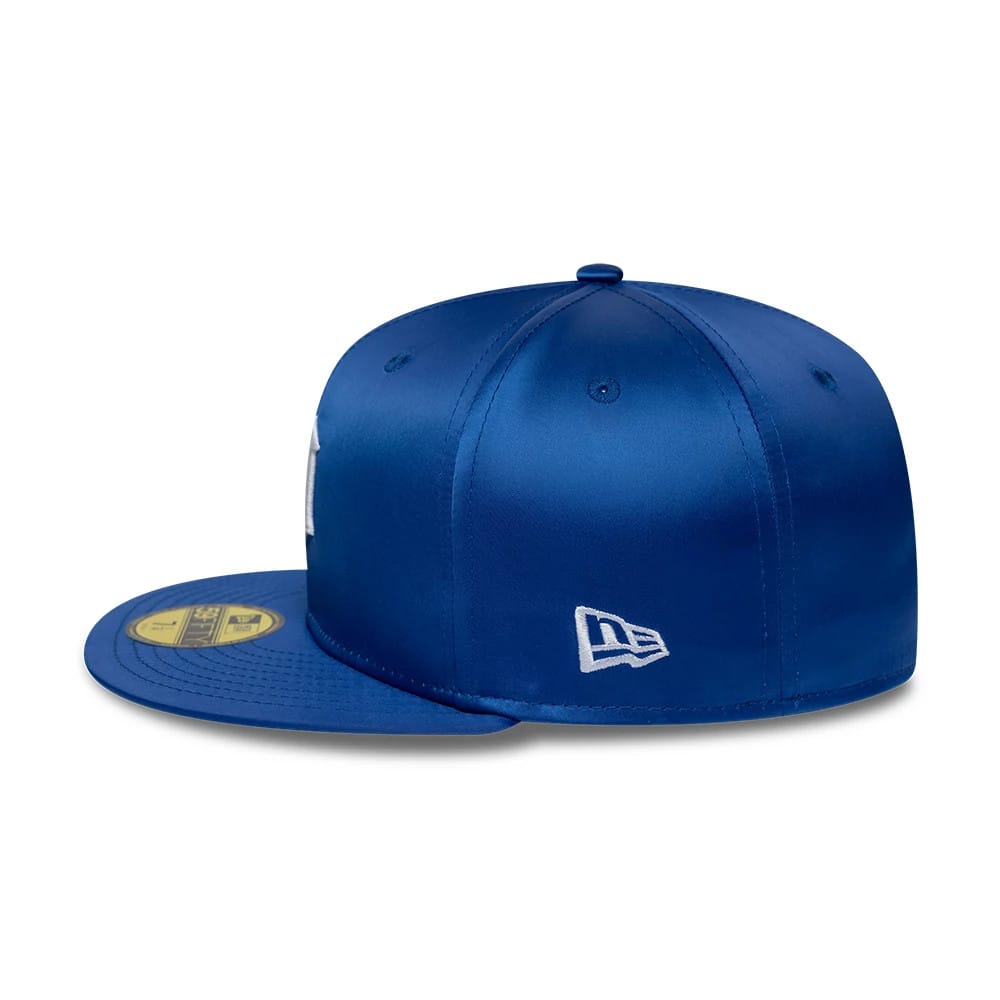 Detroit Tigers MLB Satin Blue New Era 59FIFTY Fitted Cap, side view showing the white New Era flag logo on the left side, satin finish on the structured blue crown, and a gold 59FIFTY size sticker on the flat blue visor.