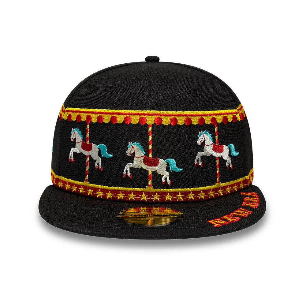 New Era Carousel Black 59FIFTY Fitted Cap, front view showing colourful embroidered carousel horse graphics on the black structured crown, a matching embroidered pattern on the flat visor, and a gold 59FIFTY size sticker on the black visor.