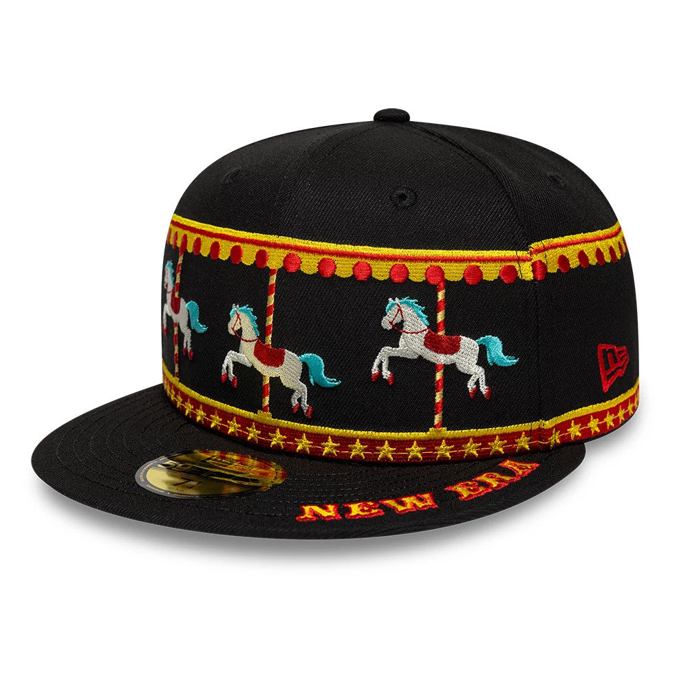 New Era Carousel Black 59FIFTY Fitted Cap, front view showing colourful carousel horse embroidery on the black crown, a red and yellow New Era logo on the visor, and a gold 59FIFTY size sticker on the flat visor.
