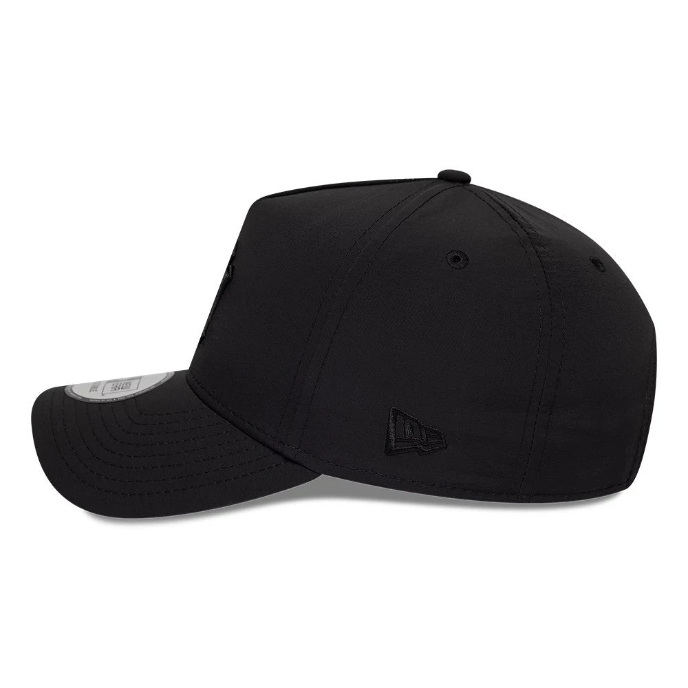 New York Yankees MLB Recycled Black On Black New Era 9FORTY E-Frame Adjustable Cap, side view showing the black embroidered New Era flag logo on the left side, structured black crown with a curved black visor and 9FORTY size sticker.