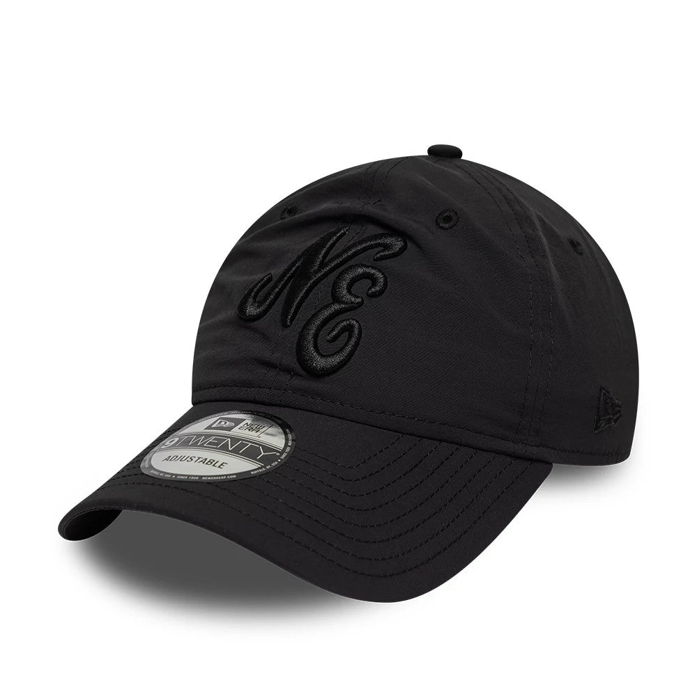 New Era Recycled Black On Black 9TWENTY Adjustable Cap, front view showing raised embroidered NE logo on the front panel in black thread, matching curved black visor, and 9TWENTY size sticker on the visor.