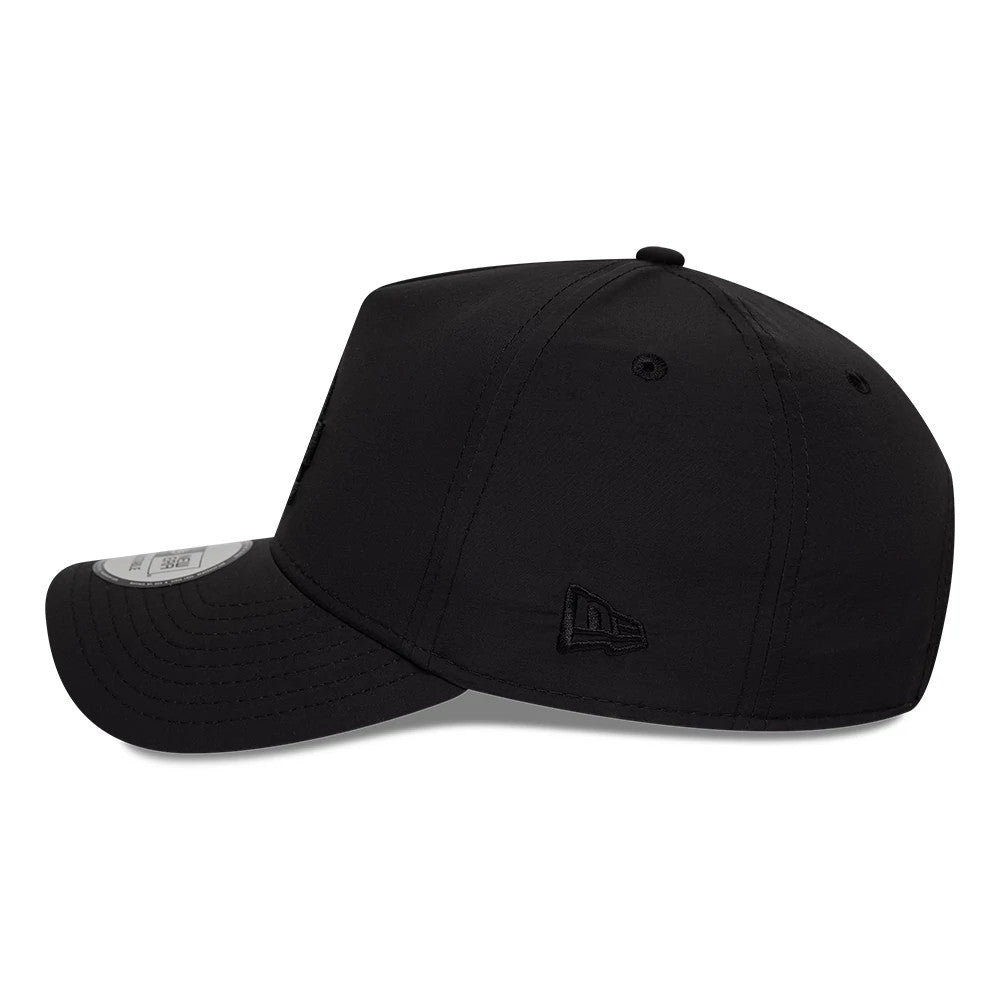 LA Dodgers MLB Recycled Black On Black New Era 9FORTY E-Frame Adjustable Cap, side view showing the black New Era flag logo embroidered on the left, six-panel structured crown with eyelets, and pre-curved black visor with a 9FORTY size sticker.
