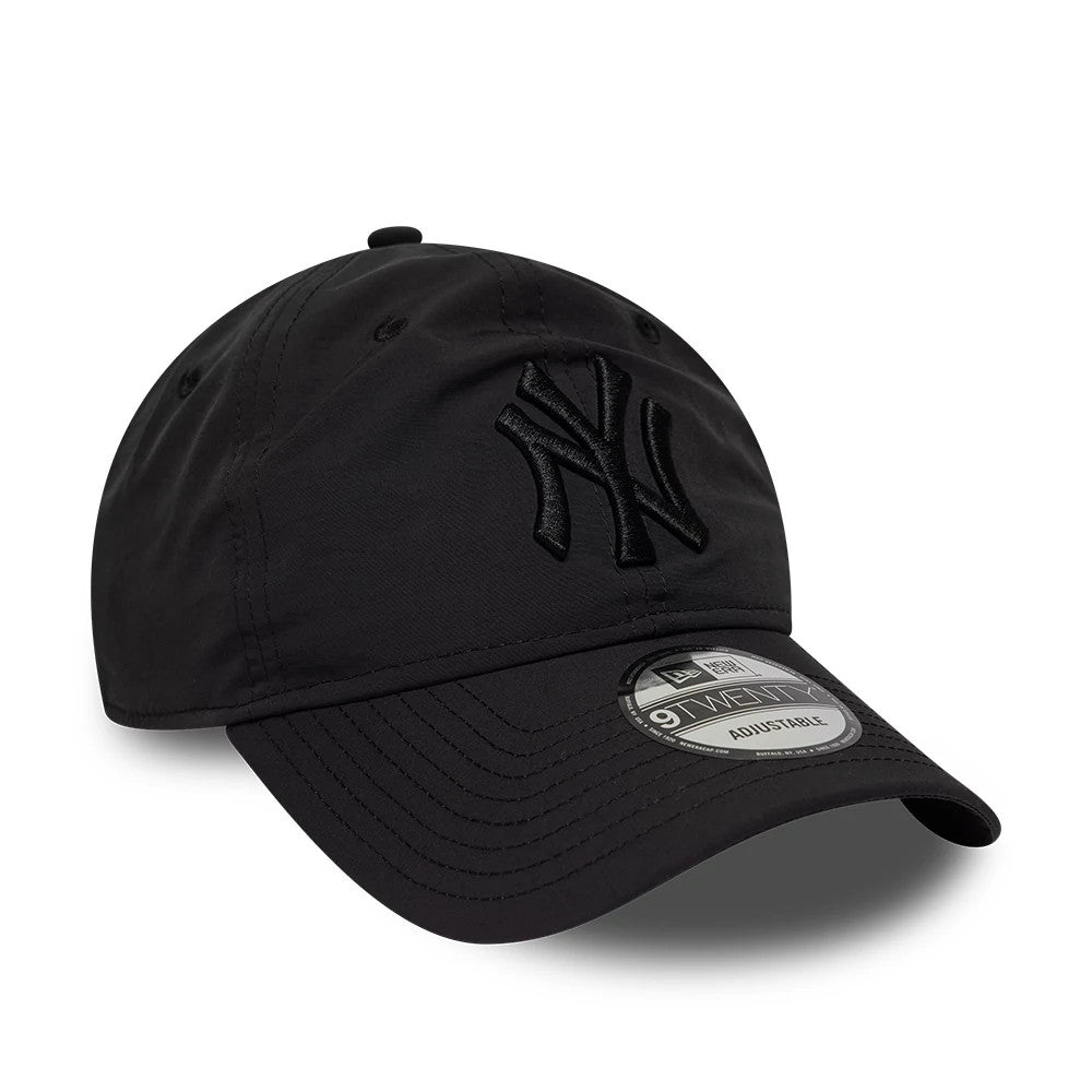 New York Yankees MLB Recycled Black On Black New Era 9TWENTY Adjustable Cap, three-quarter view showing a raised black NY logo embroidered on the structured black front panel, with a curved black visor and a 9TWENTY size sticker.