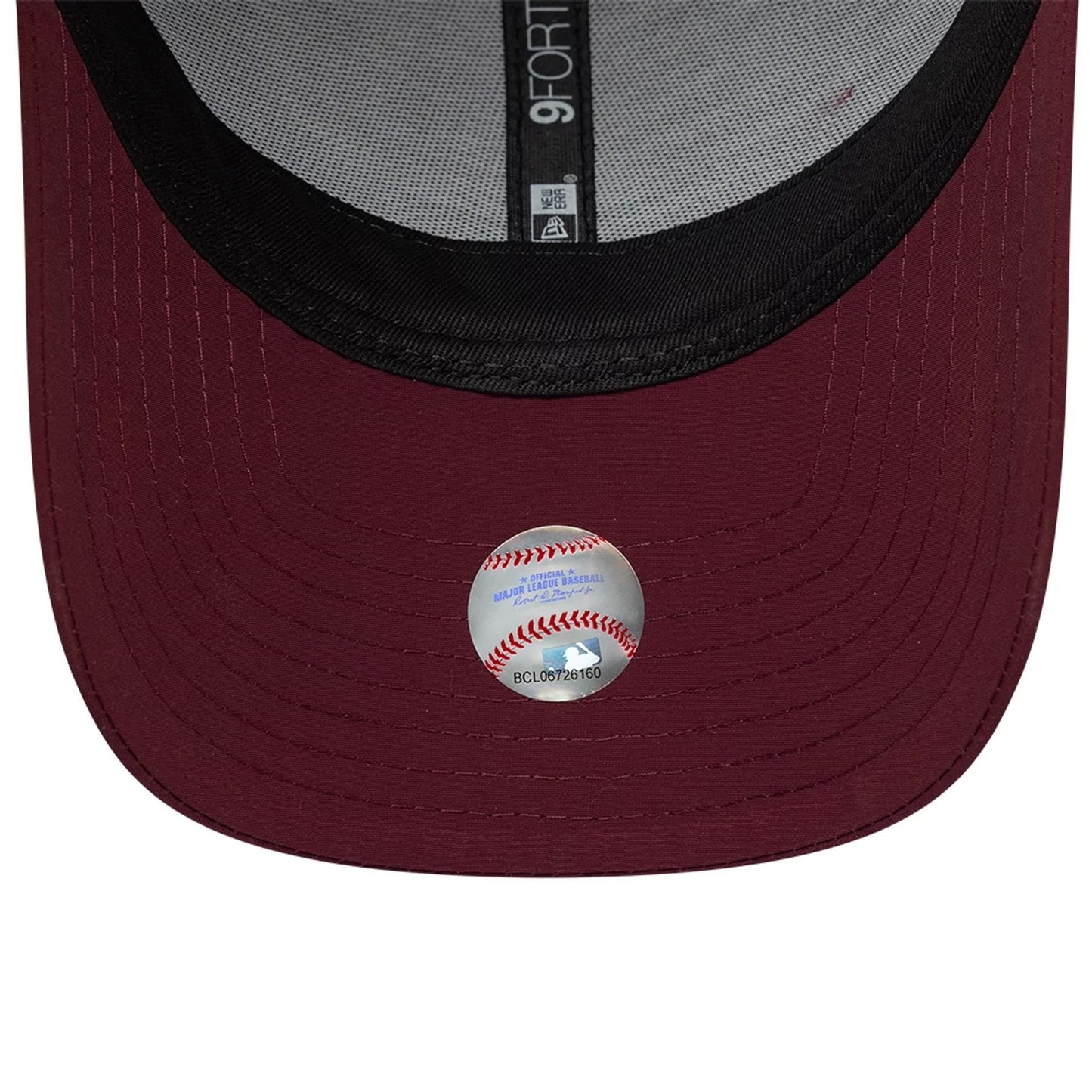New Era Mini Logo Recycled Dark Red 9FORTY Adjustable Cap, inside view showing a grey sweatband, black undervisor and taping with the 9FORTY label, and an MLB sticker attached to the centre of the dark red curved visor.