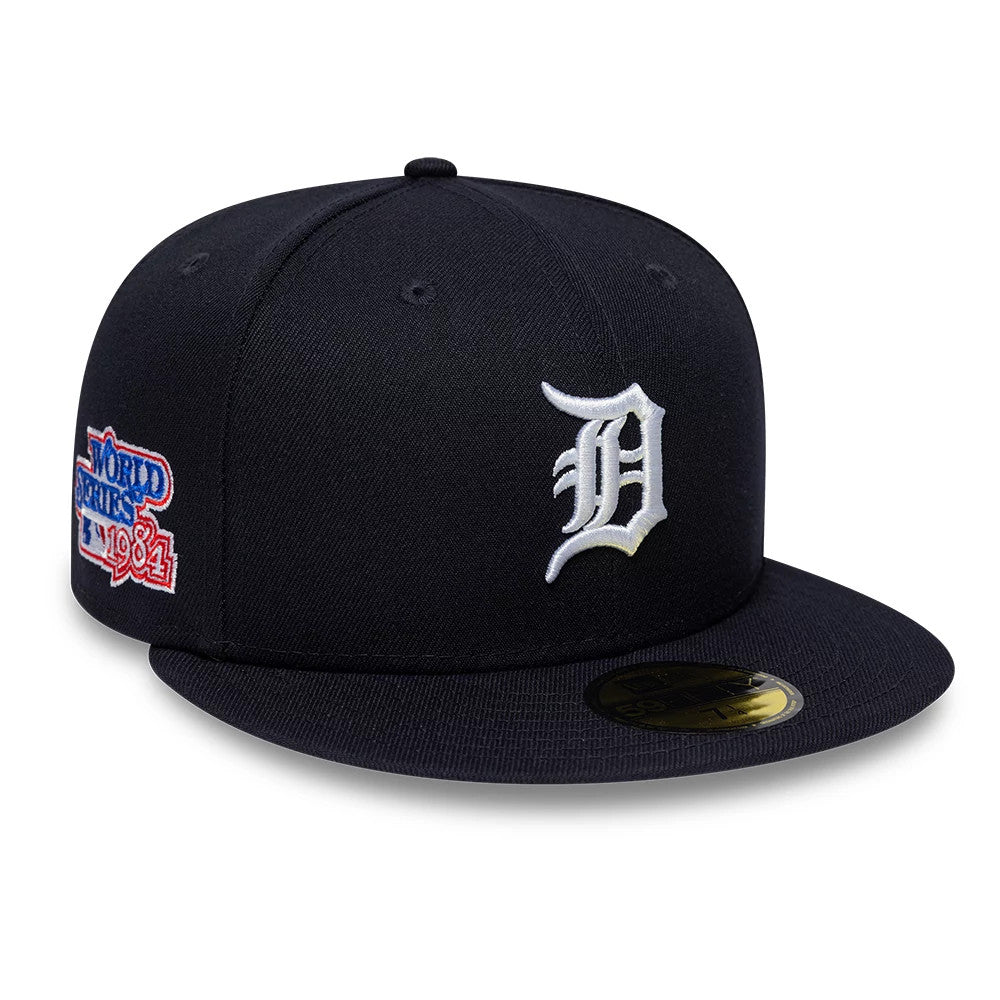 Detroit Tigers MLB Sidepatch Satin Lined Navy New Era 59FIFTY Fitted Cap, three-quarter view showing the raised white embroidered D logo on the front panel, a 1984 World Series side patch, and a gold 59FIFTY size sticker on the flat visor.