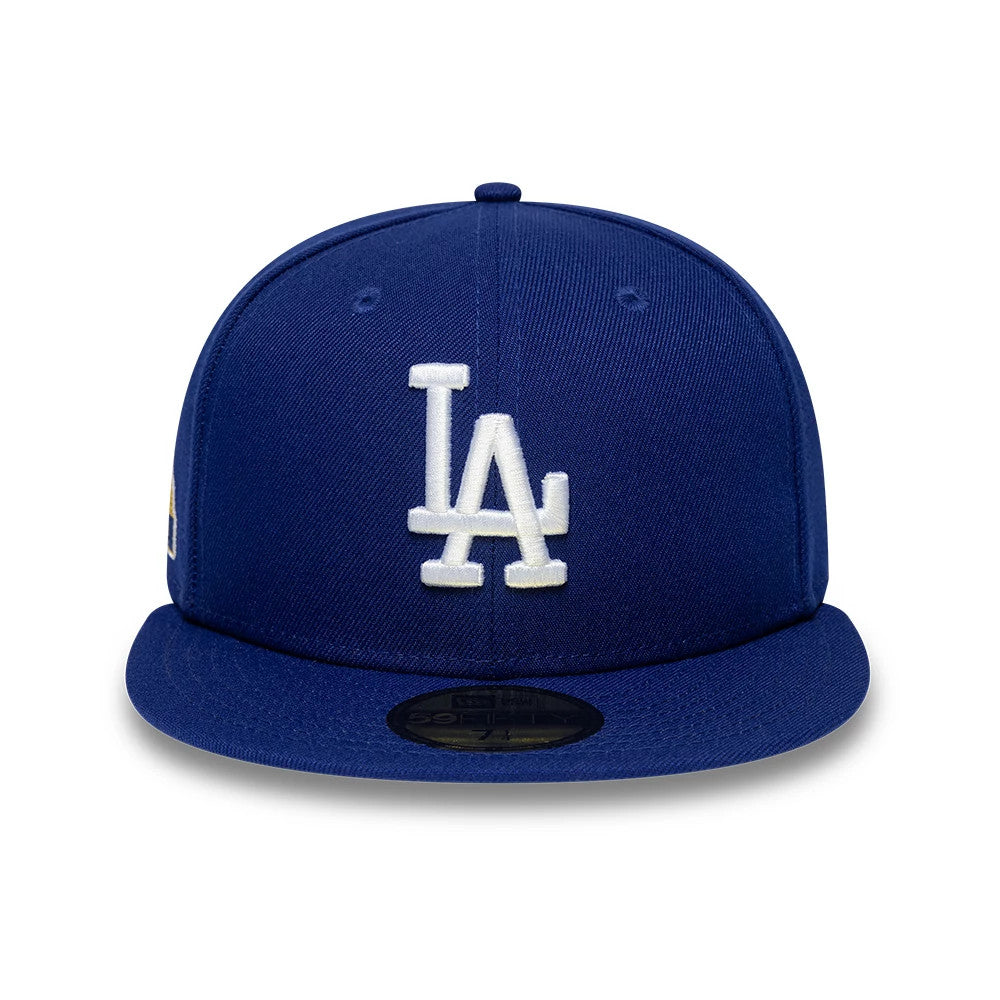 LA Dodgers MLB Sidepatch Satin Lined Dark Blue New Era 59FIFTY Fitted Cap, front view showing the white embroidered LA logo on the structured dark blue crown, a flat dark blue visor, and a gold 59FIFTY size sticker on the visor.