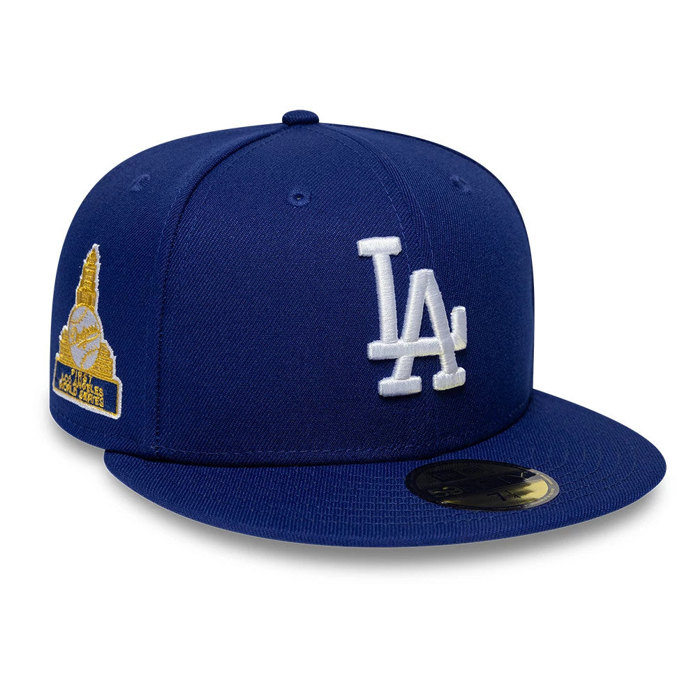 LA Dodgers MLB Sidepatch Satin Lined Dark Blue New Era 59FIFTY Fitted Cap, three-quarter view showing the white embroidered LA logo on the front panel, a golden embroidered side patch on the left.