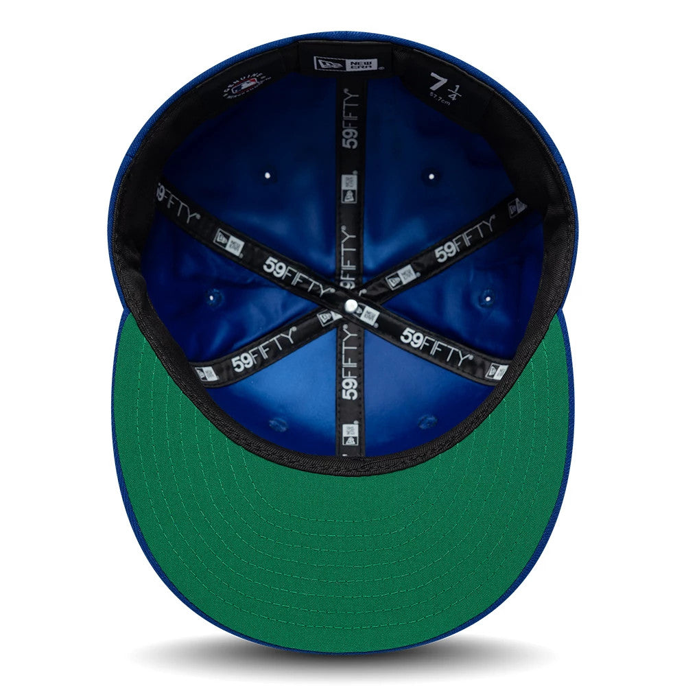 New York Mets MLB Sidepatch Satin Lined Blue New Era 59FIFTY Fitted Cap, inside view showing a blue satin lining, black 59FIFTY branded tape, and a green undervisor with stitching on the structured interior crown.