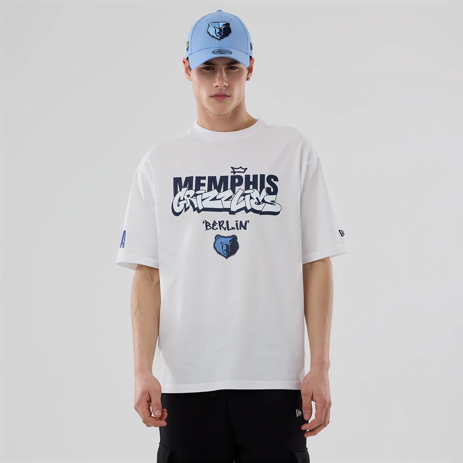 The model is wearing this NBA Berlin Game 2026 Memphis Grizzlies Oversized T-Shirt in white. 1