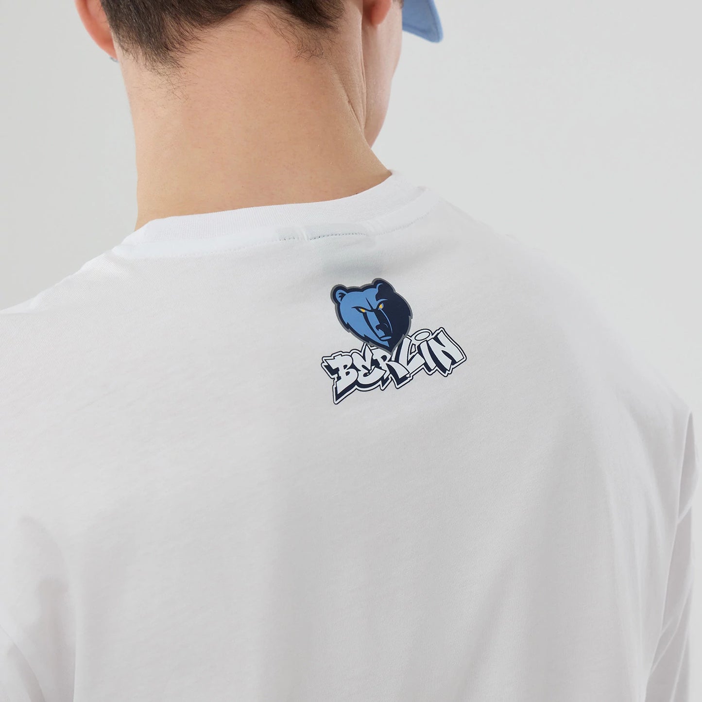 The model is wearing this NBA Berlin Game 2026 Memphis Grizzlies Oversized T-Shirt in white. 7