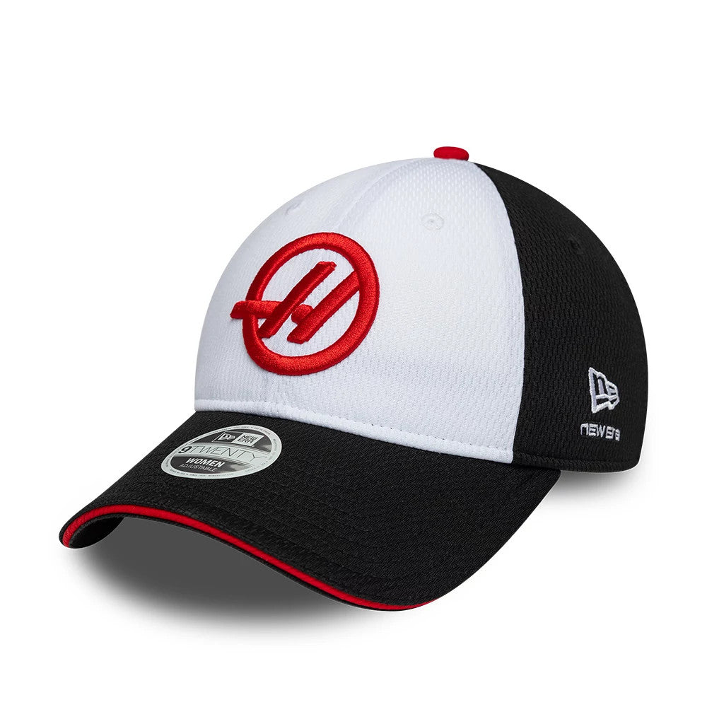 New Era TGR Haas F1 Womens Black Open Back Cap, three-quarter view showing a red embroidered logo on the front panel, a contrasting black visor with a red edge and 9TWENTY size sticker, and the New Era flag logo on the black side panel.