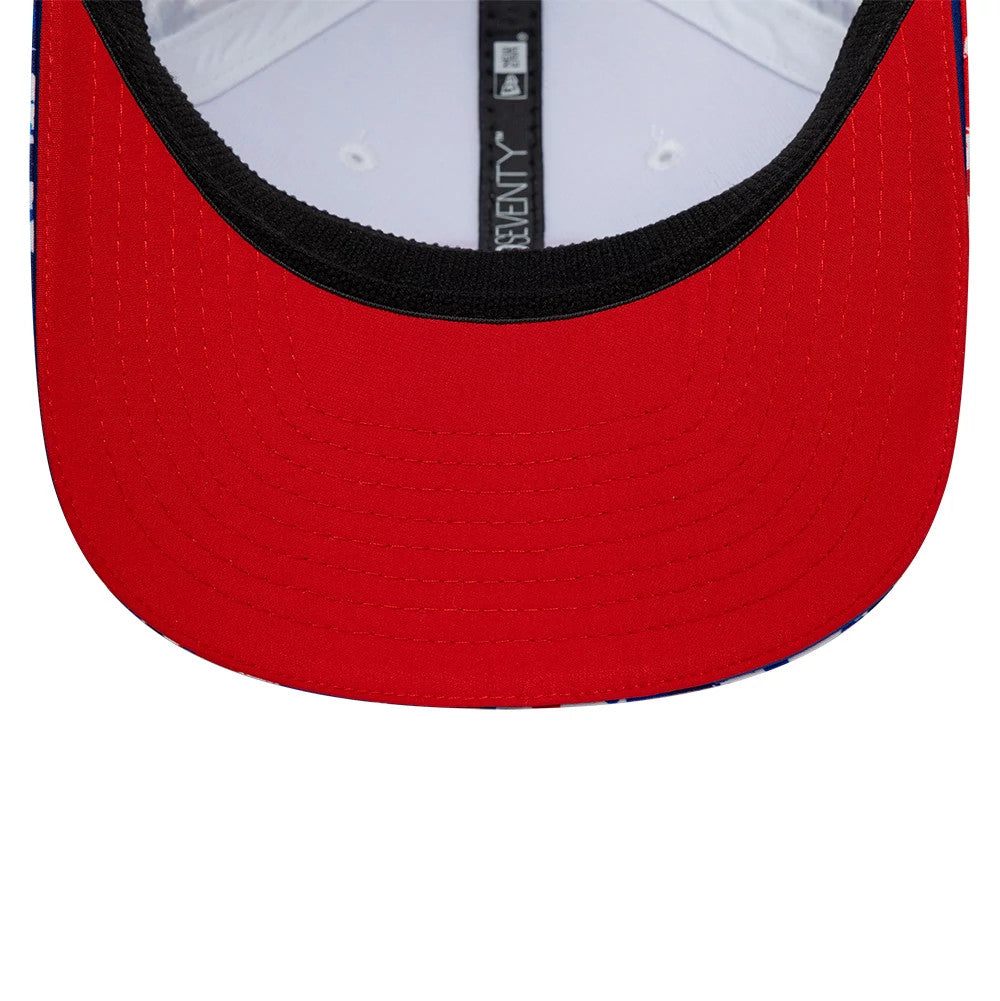 TGR Haas F1 Team Silverstone Race Special White New Era 9SEVENTY Stretch Snap Cap, inside view showing a red undervisor beneath a black sweatband, with white interior eyelets and black taping bearing the 9SEVENTY logo.